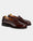 Still life photo of Velasca cordovan leather penny loafer.